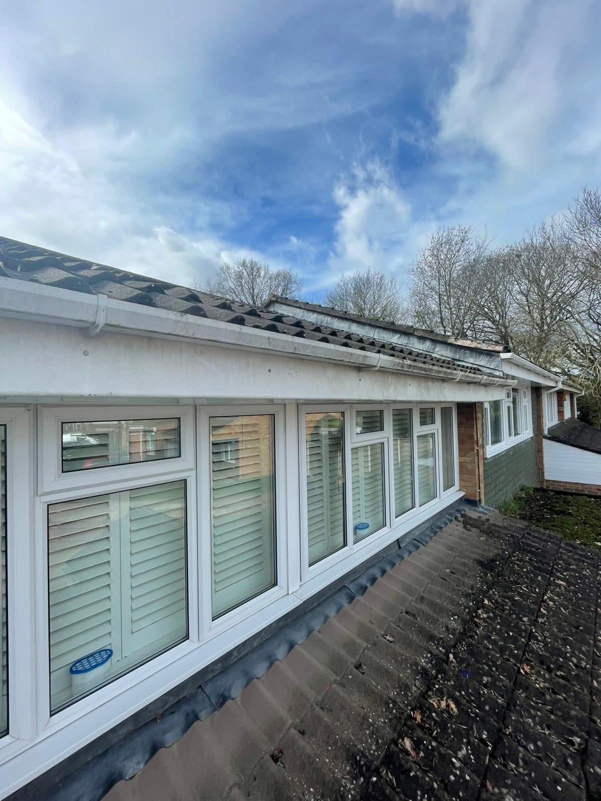 Gutter clearing access at roof edge
